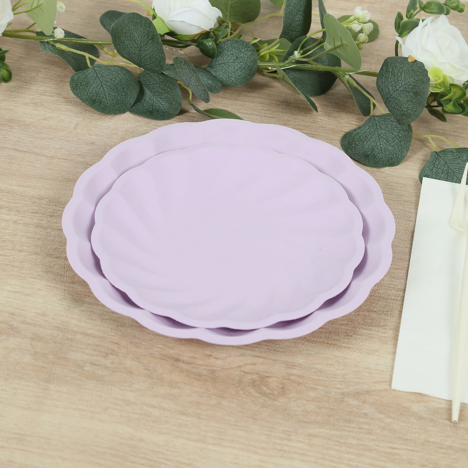 Lavender lilac biodegradable salad plates with scalloped edges.
