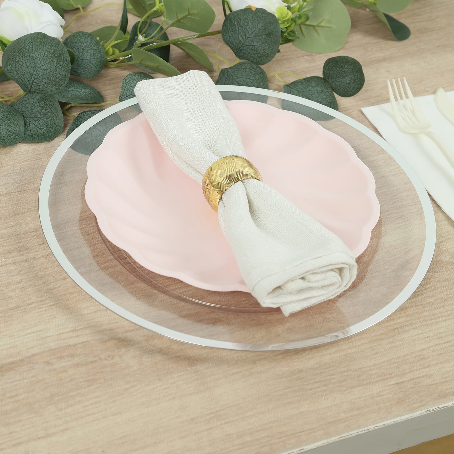 Blush biodegradable dinner plate with elegant swirl scalloped design.
