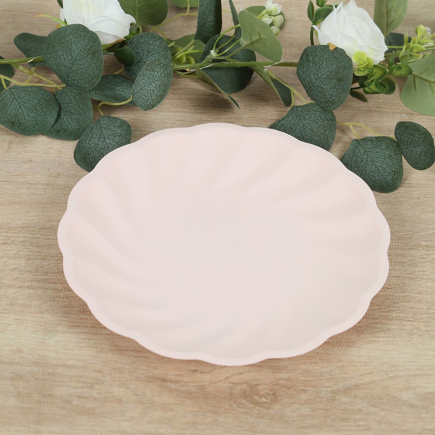 Blush biodegradable scalloped dinner plate with elegant design.