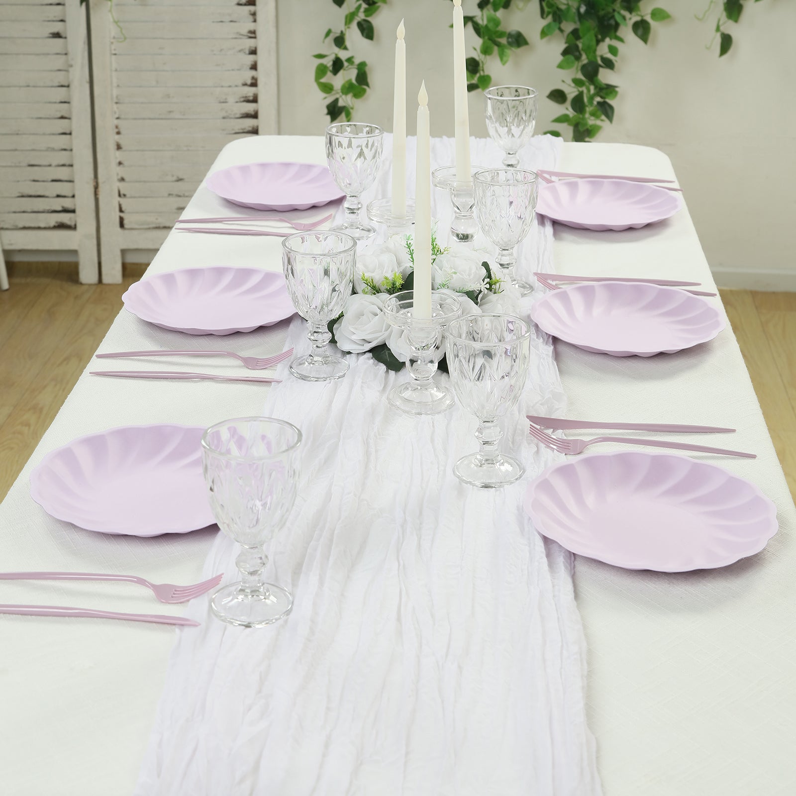 Lavender lilac biodegradable dinner plates on a elegantly set table.