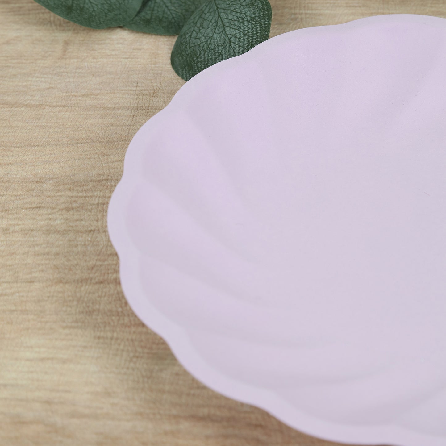 Lavender lilac biodegradable dinner plate with scalloped edges.