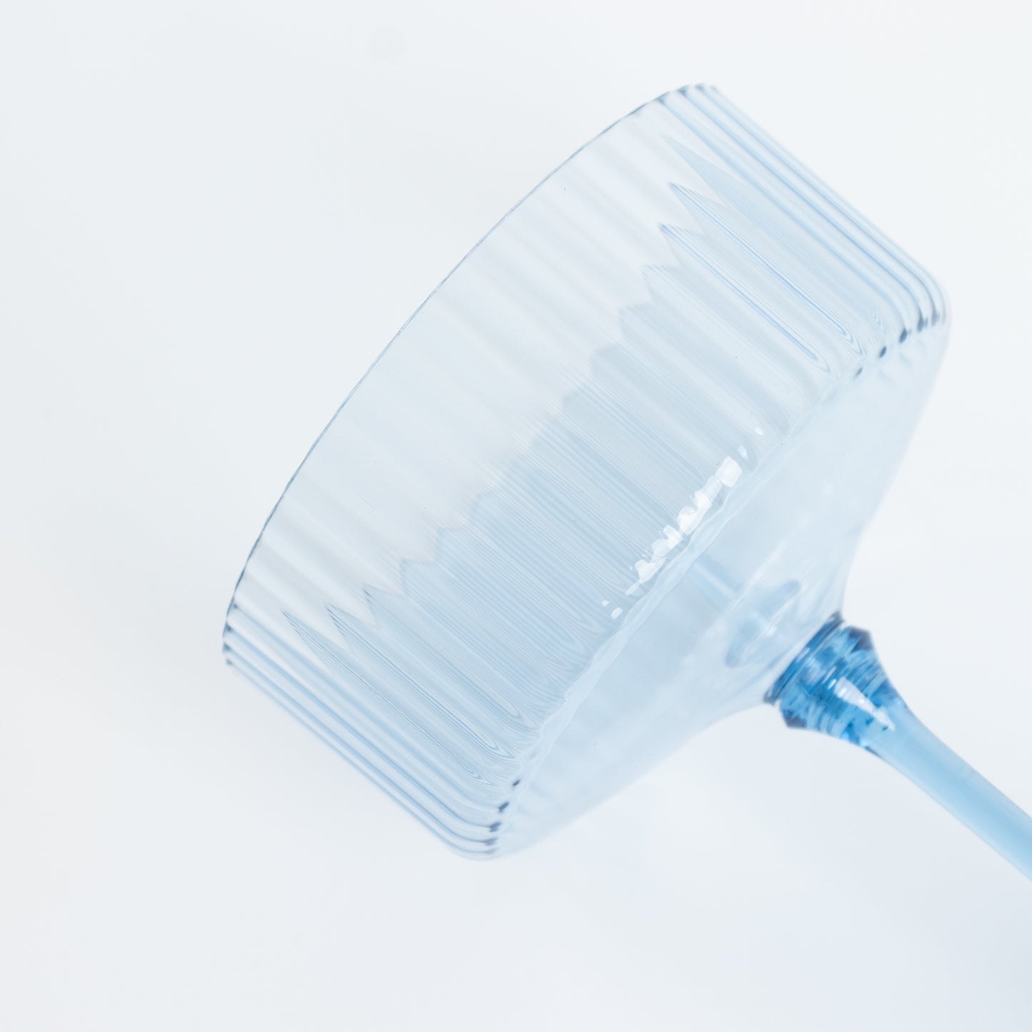 Dusty blue ribbed disposable cocktail glass with detachable stem.