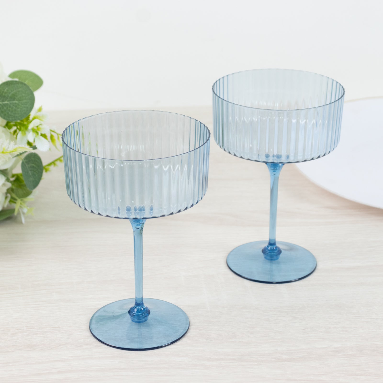 Dusty blue ribbed disposable champagne glasses for parties.