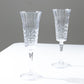Clear reusable cocktail champagne flutes with embossed leaf pattern.