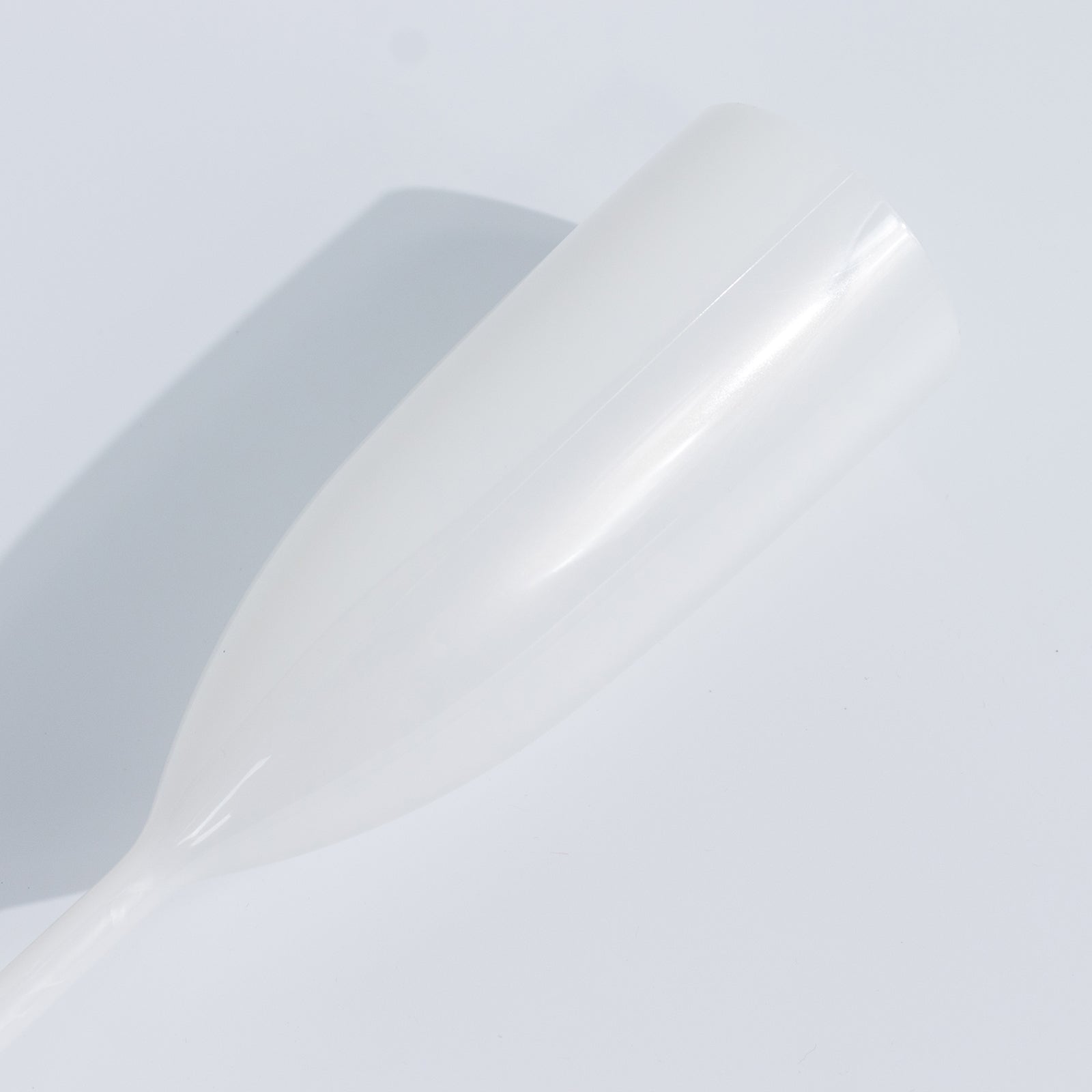 Pearl white shatterproof champagne flute for celebrations.