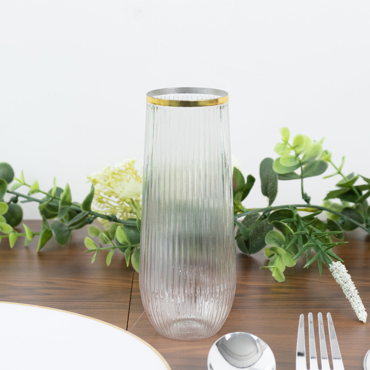 Clear champagne flute with gold rim, ribbed design. Perfect for toasting.