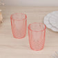 Transparent blush reusable plastic tumbler glasses in crystal cut style.