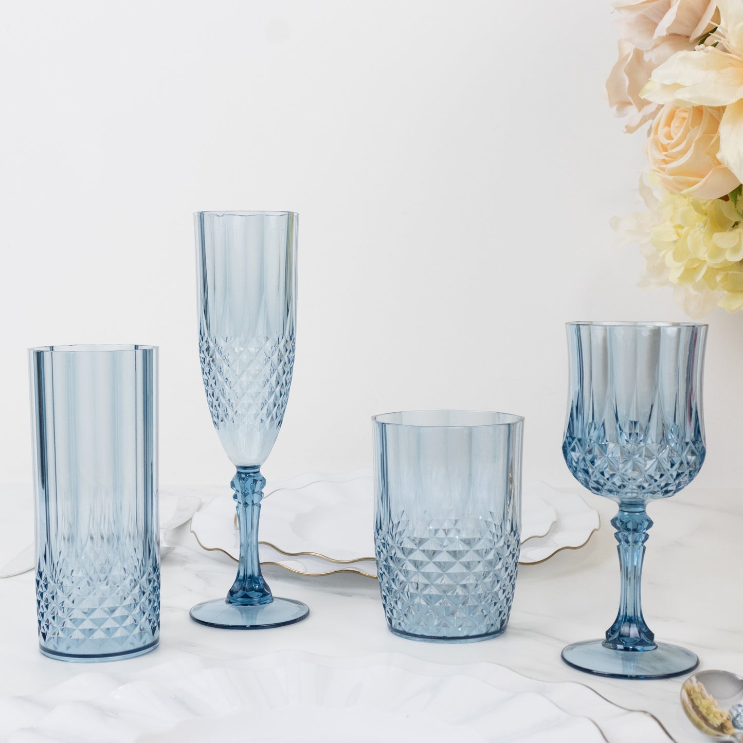 Dusty blue shatterproof tumbler glasses in crystal cut style.