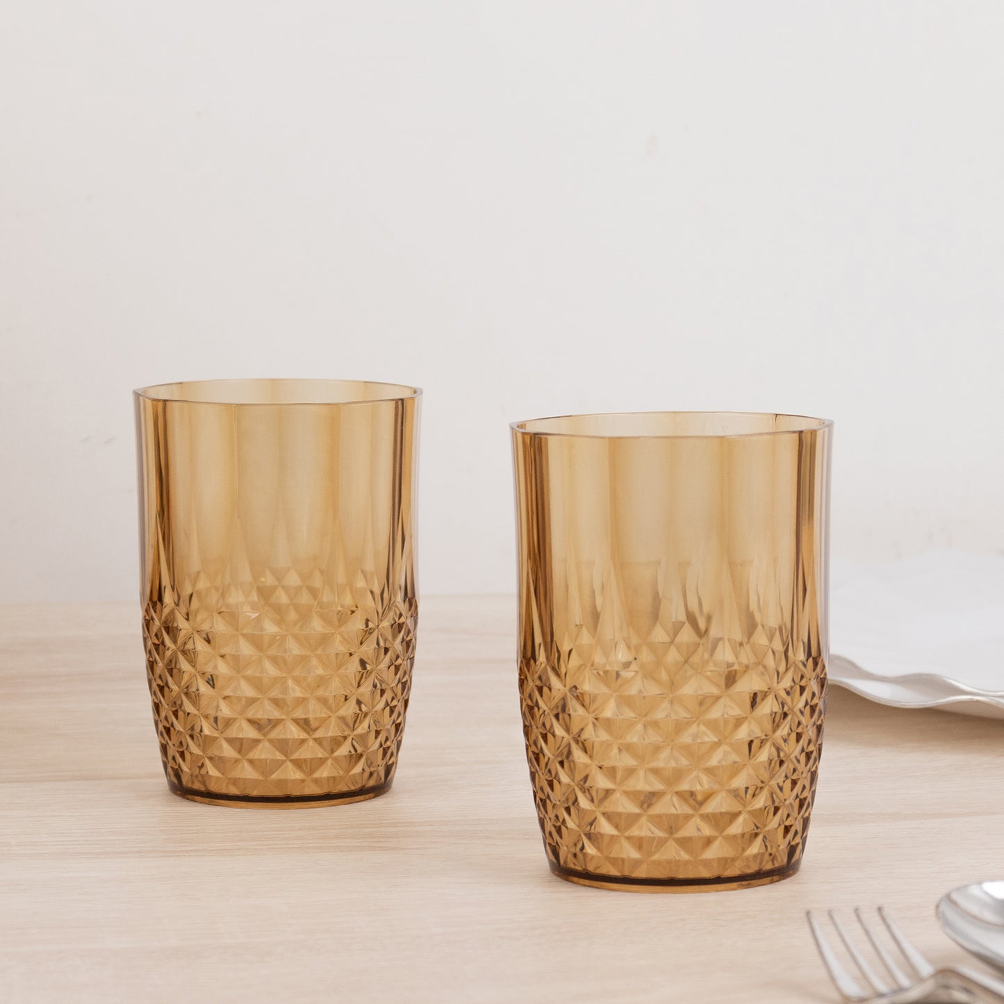 Amber gold reusable plastic tumbler glasses, shatterproof, 16oz, crystal cut style.