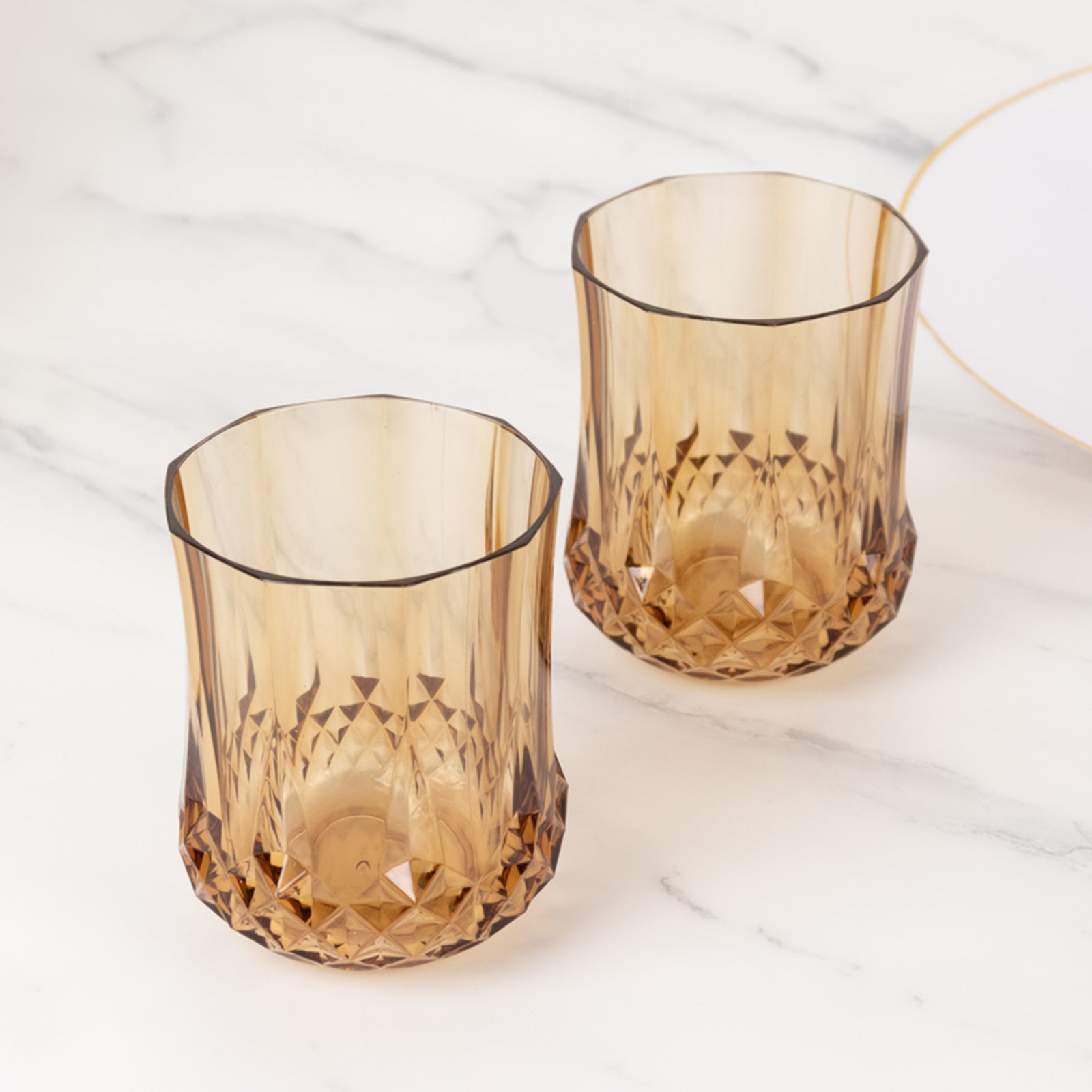 Amber gold crystal cut plastic stemless wine glasses, shatterproof and reusable.