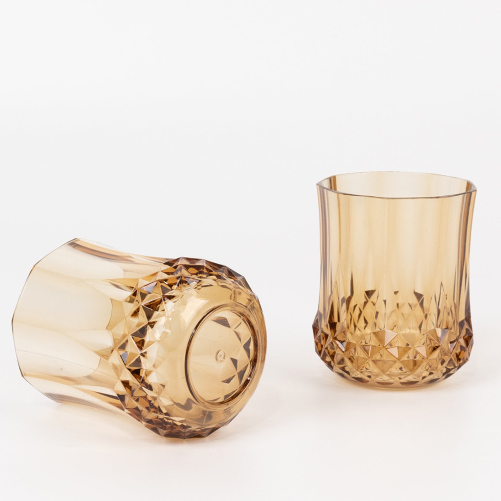 Amber gold stemless wine glasses, shatterproof and reusable, ideal for whiskey.