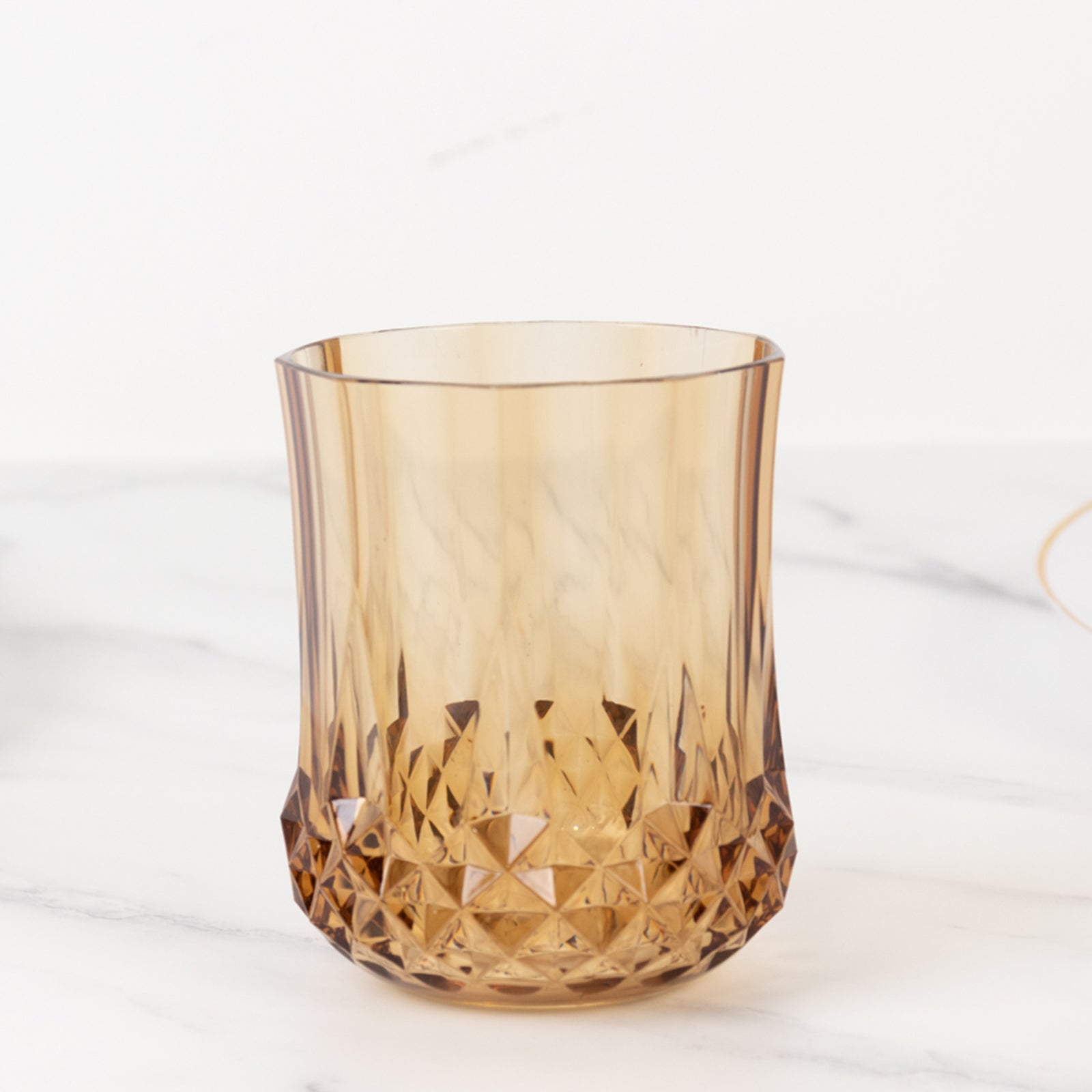 Amber gold stemless wine glass, shatterproof, reusable, 8oz capacity.