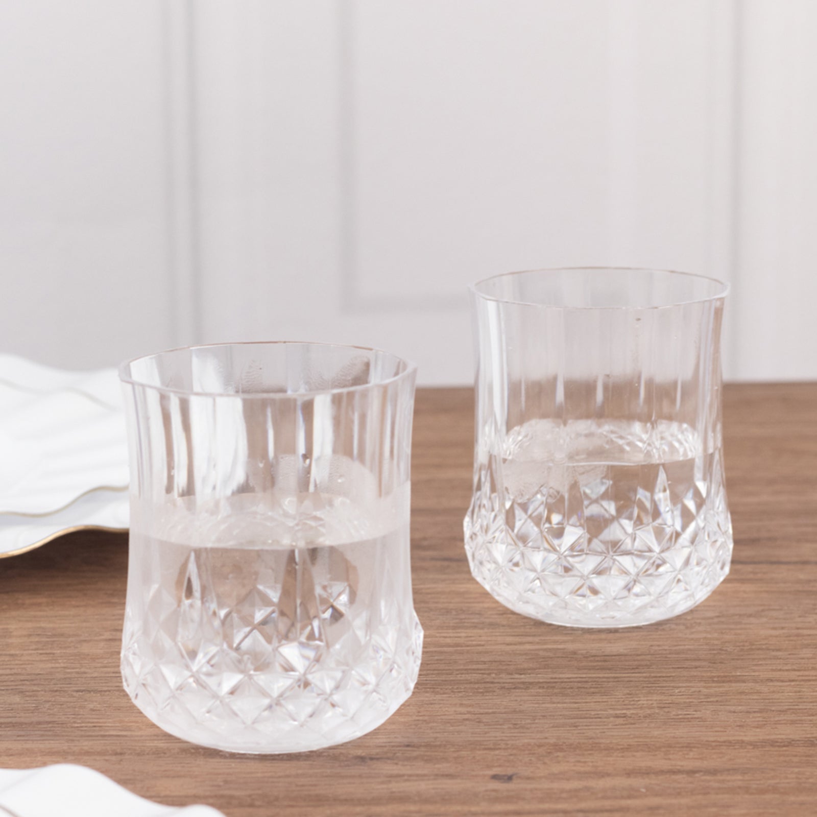 Clear crystal cut plastic stemless wine glasses, shatterproof and reusable.