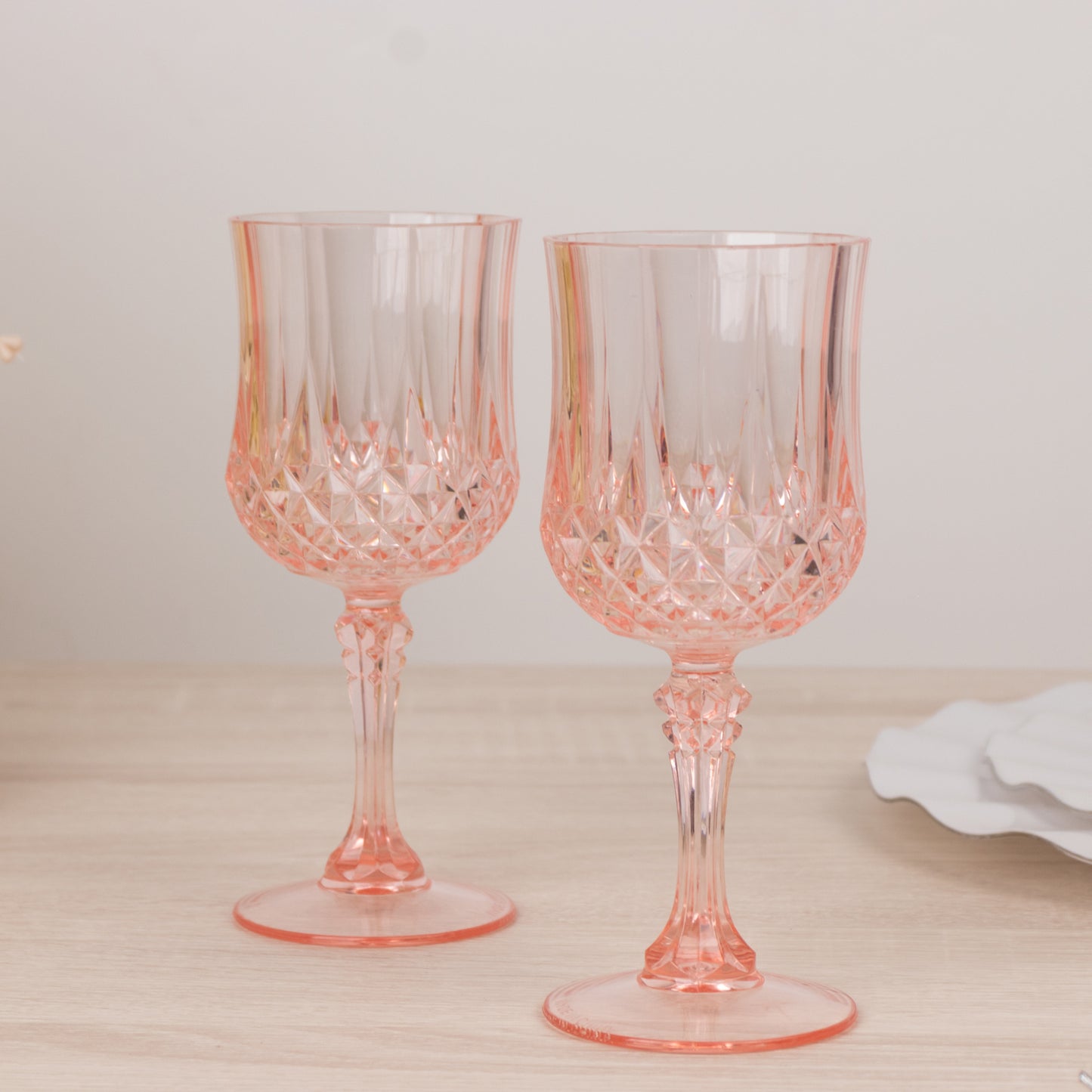 Transparent blush crystal cut cocktail goblets, shatterproof wine glasses.