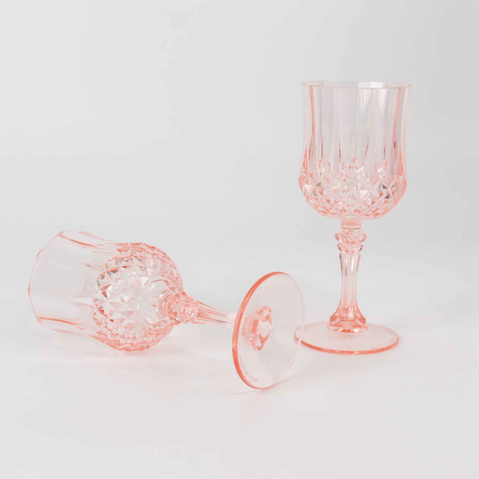 Transparent blush crystal cut cocktail goblets, shatterproof wine glasses.