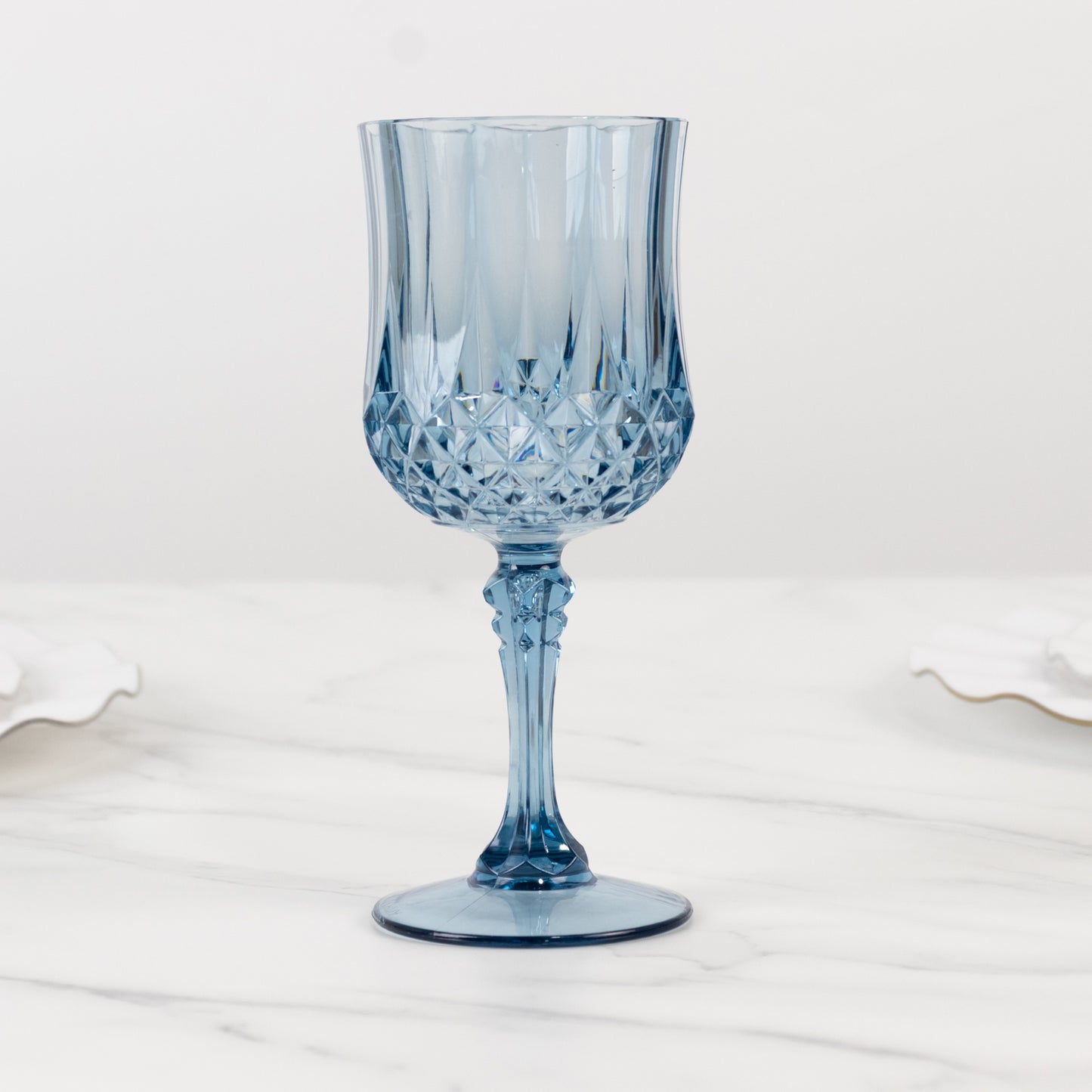 Dusty blue crystal cut reusable plastic cocktail goblet.