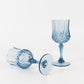 Dusty blue crystal cut reusable plastic cocktail goblets.