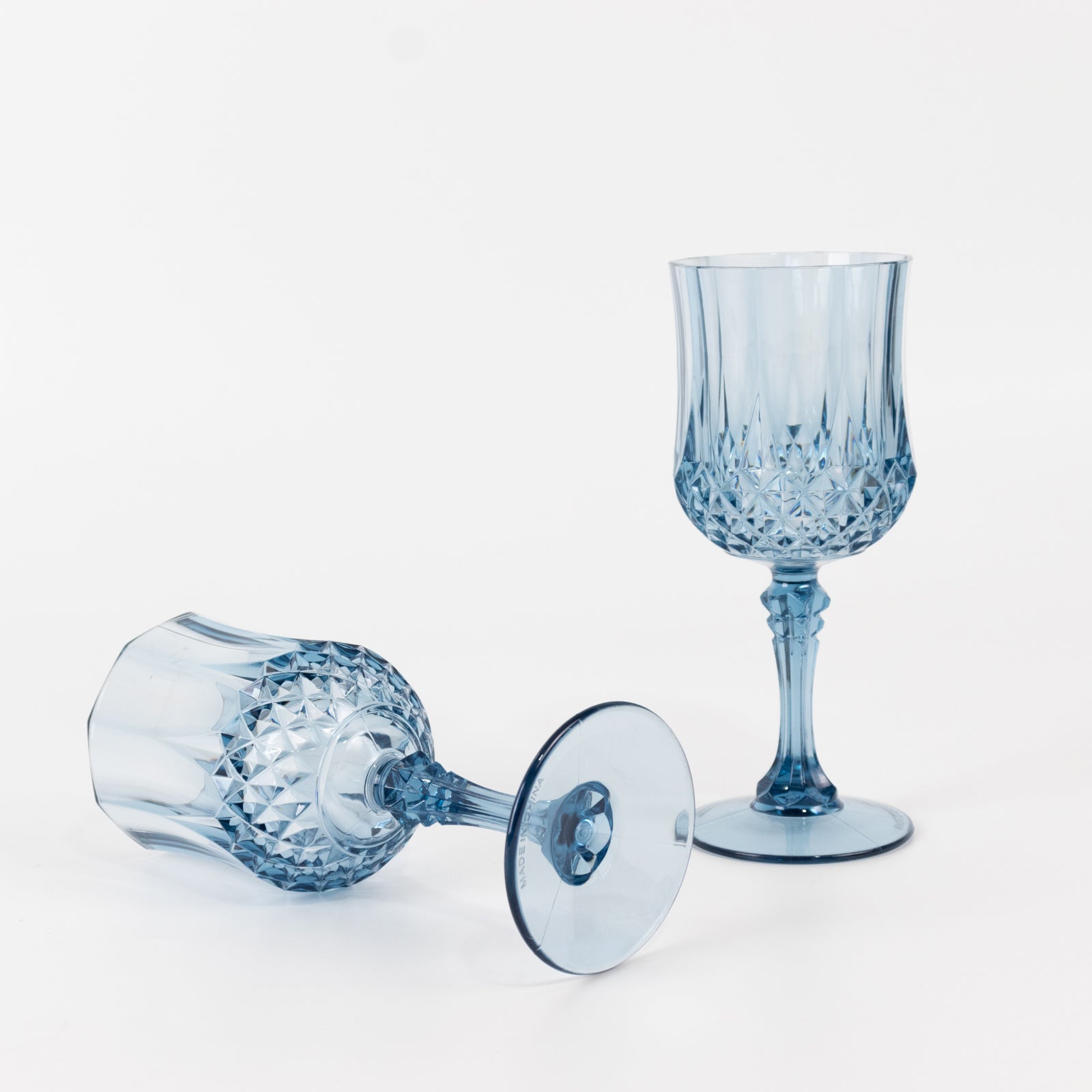 Dusty blue crystal cut reusable plastic cocktail goblets.