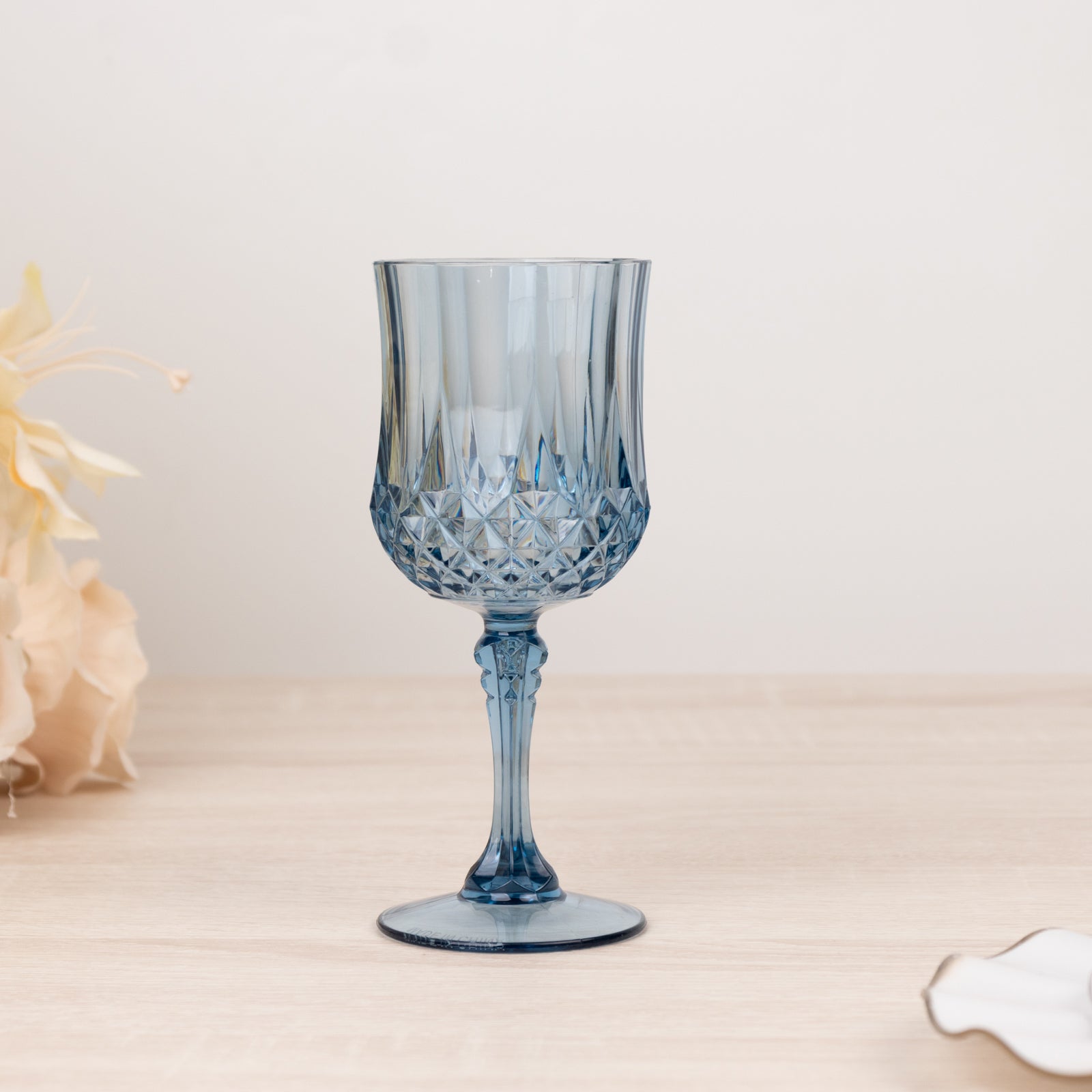 Dusty blue crystal cut reusable plastic cocktail goblet.