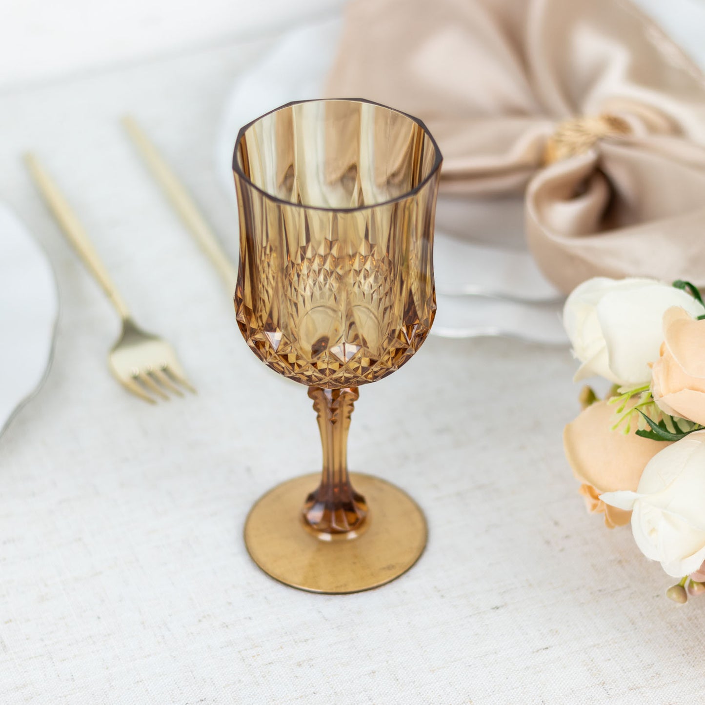 Amber gold shatterproof cocktail goblet, perfect for elegant gatherings.