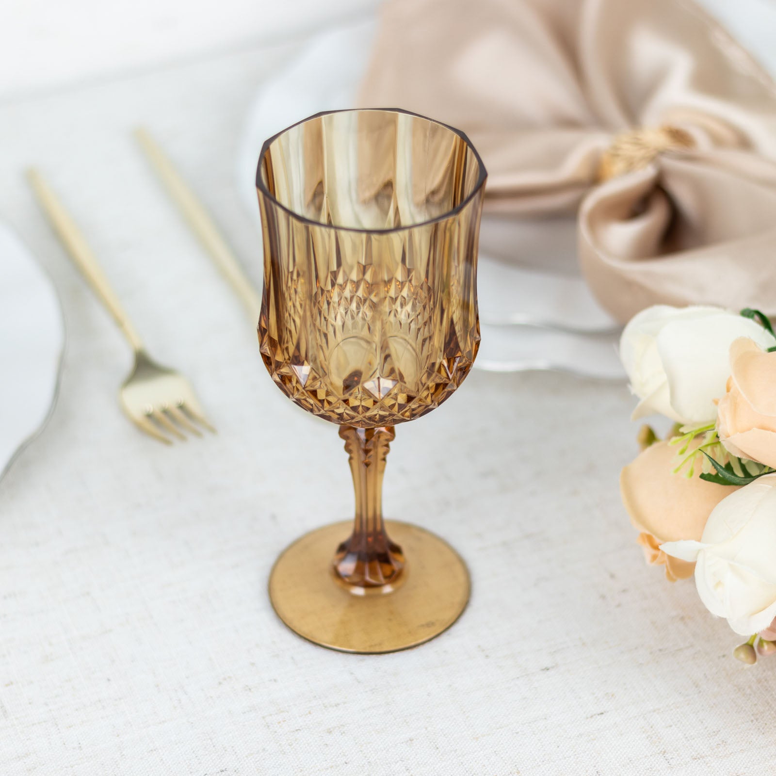 Amber gold shatterproof cocktail goblet, perfect for elegant gatherings.