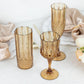 Amber gold shatterproof cocktail goblets, perfect for any occasion.