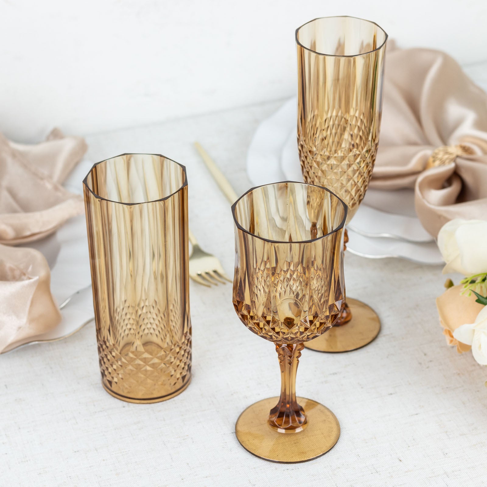 Amber gold shatterproof cocktail goblets, perfect for any occasion.