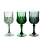 Assorted green crystal cut reusable plastic cocktail goblets.