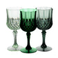 Assorted green crystal cut reusable plastic cocktail goblets.