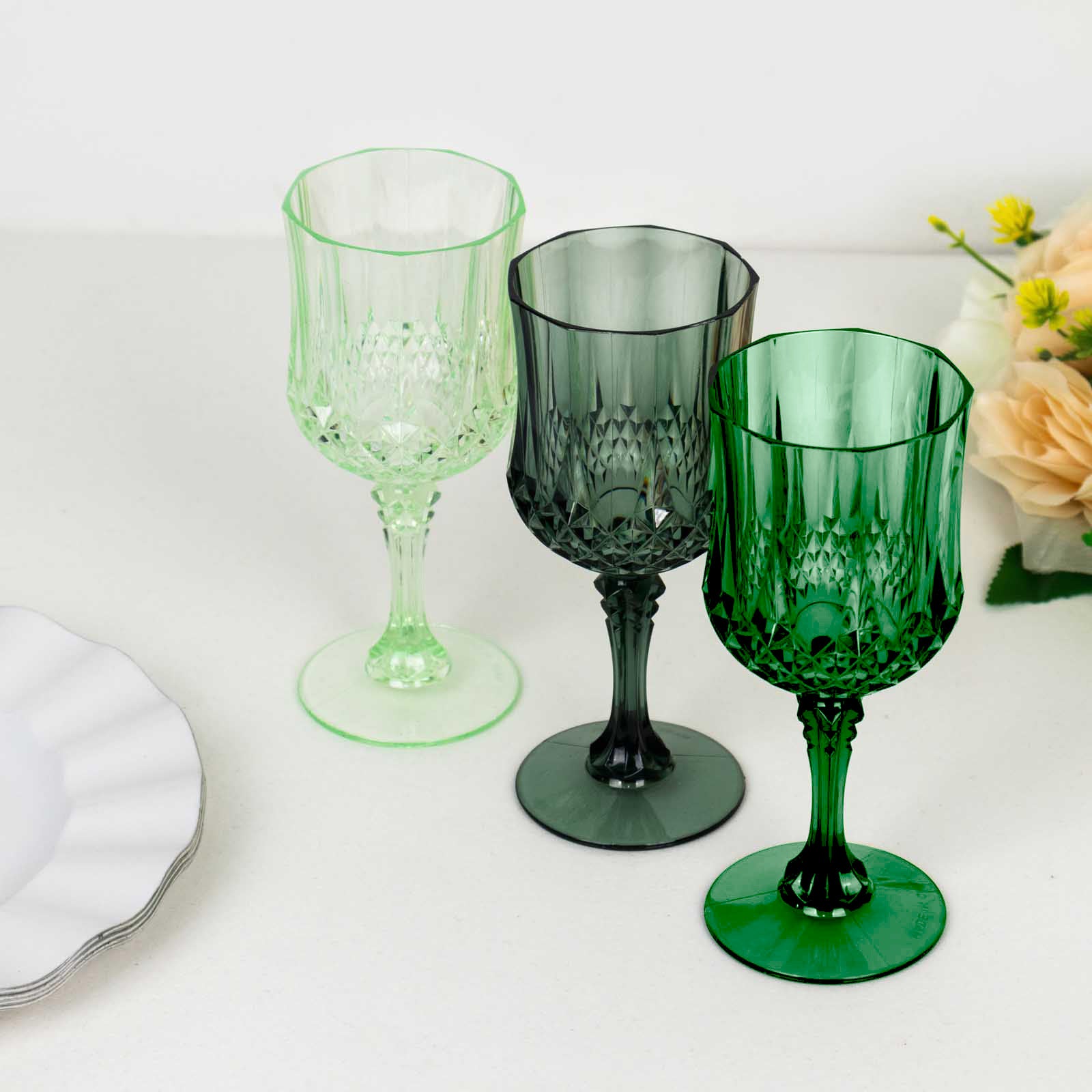 Assorted green crystal cut reusable plastic cocktail goblets
