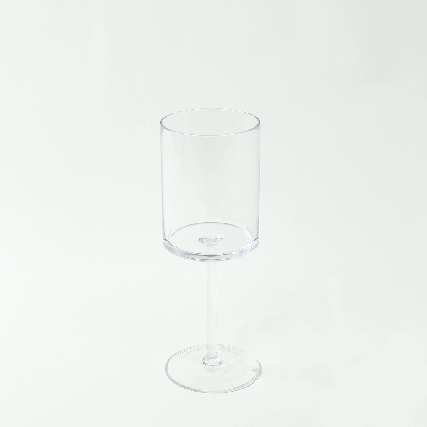 Clear plastic reusable cocktail glass with long stem, 10oz capacity.