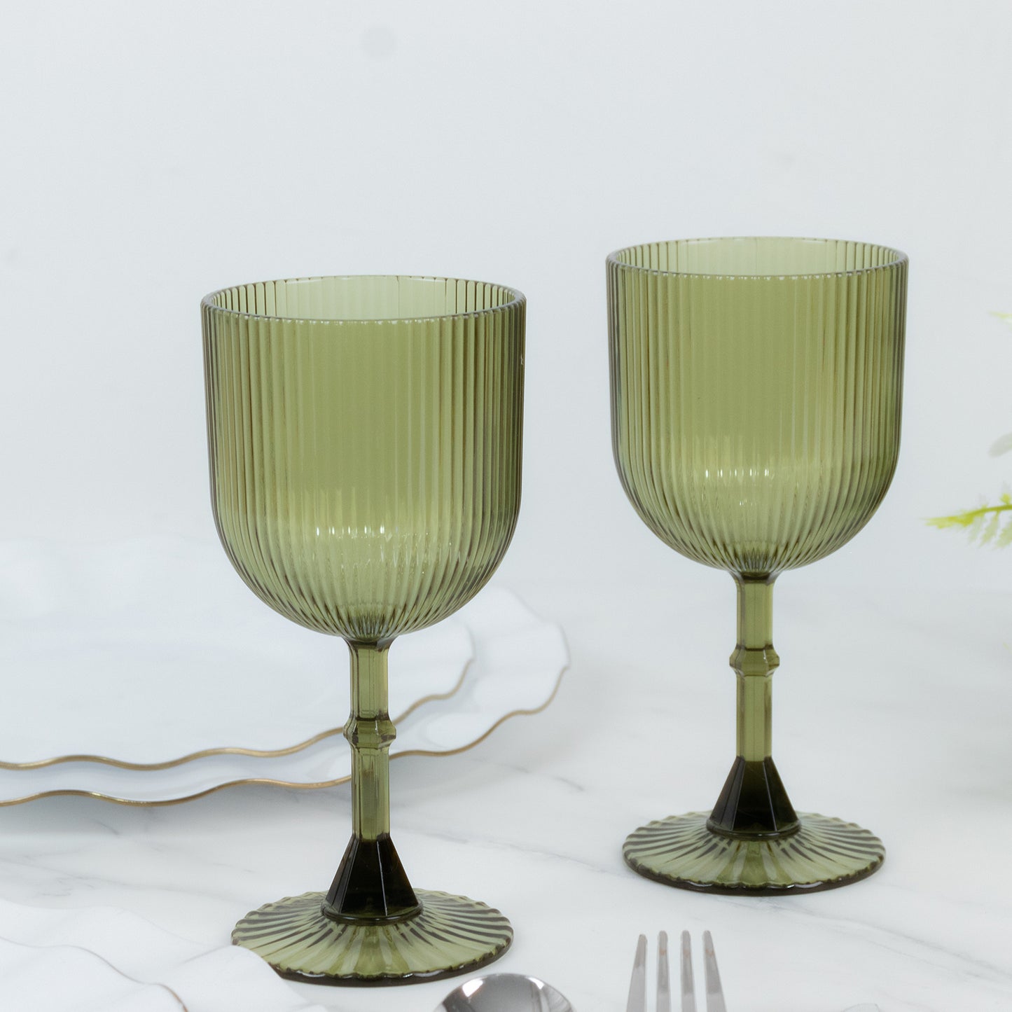 Dusty sage green vintage ribbed plastic goblets, reusable and shatterproof.
