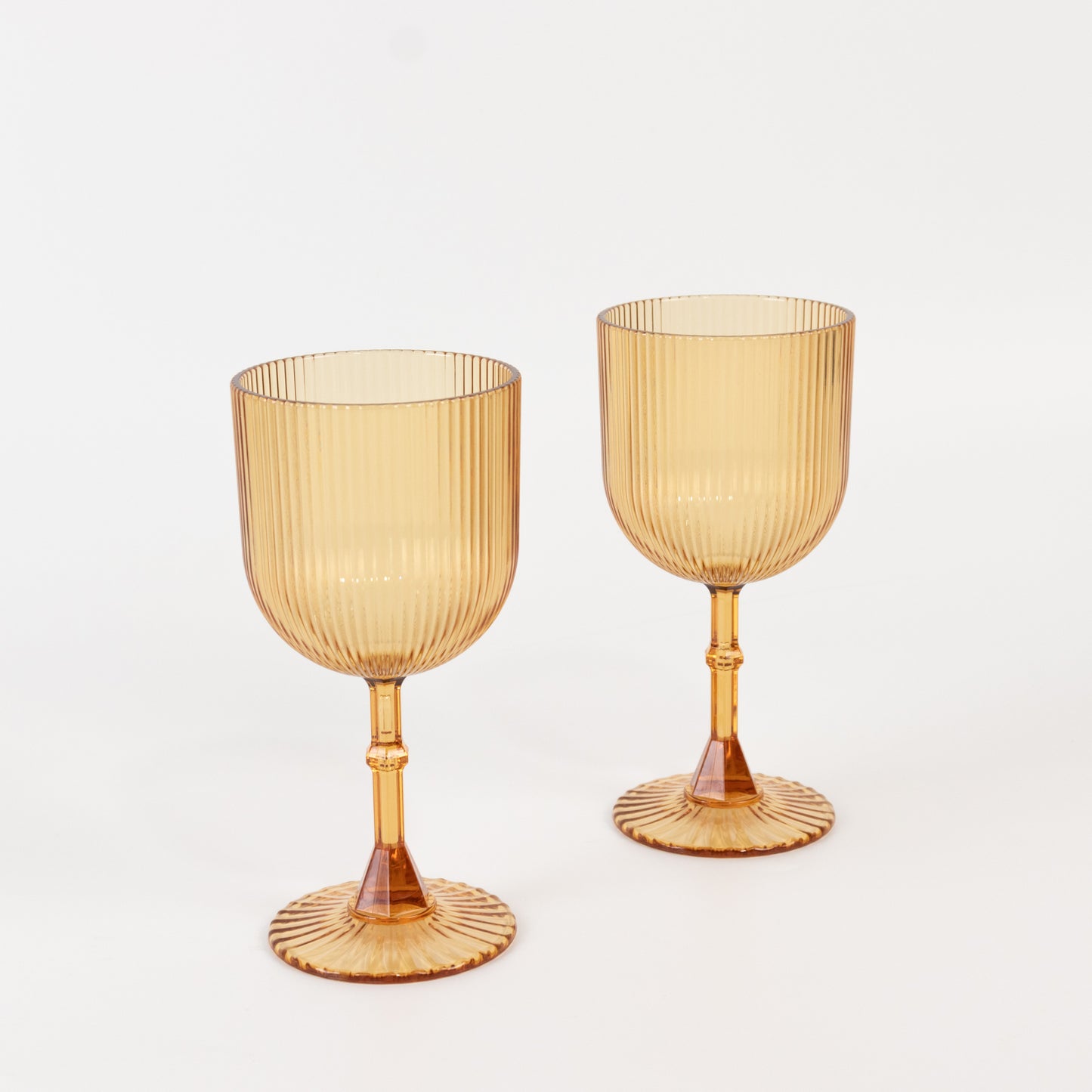 Amber gold ribbed reusable plastic wine goblets, shatterproof vintage design.