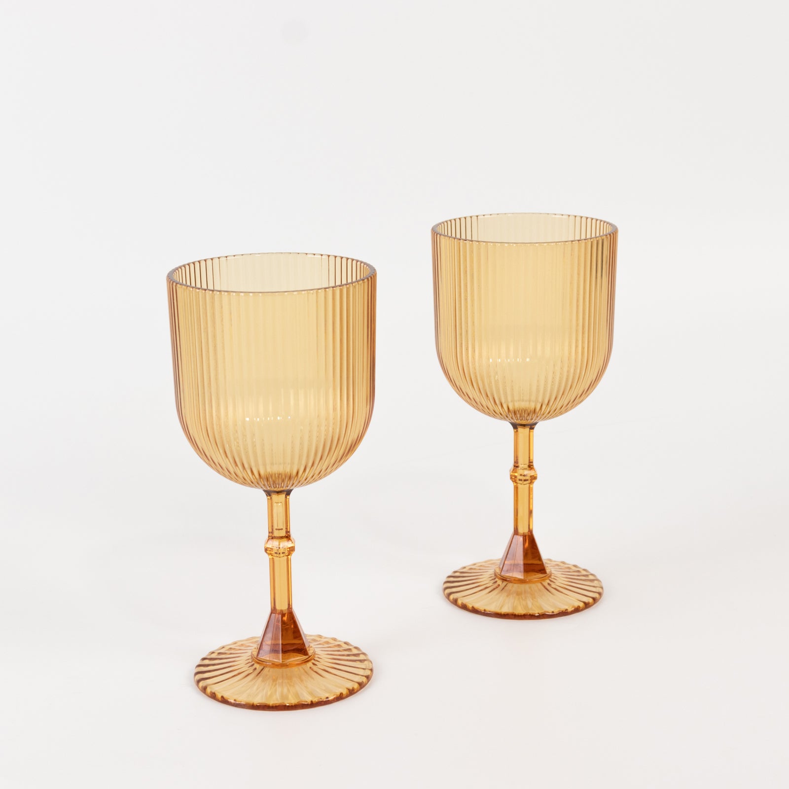 Amber gold ribbed reusable plastic wine goblets, shatterproof vintage design.