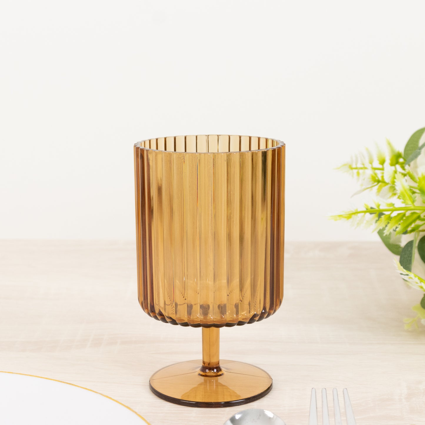 Amber gold vintage ribbed short stem reusable wine glass.