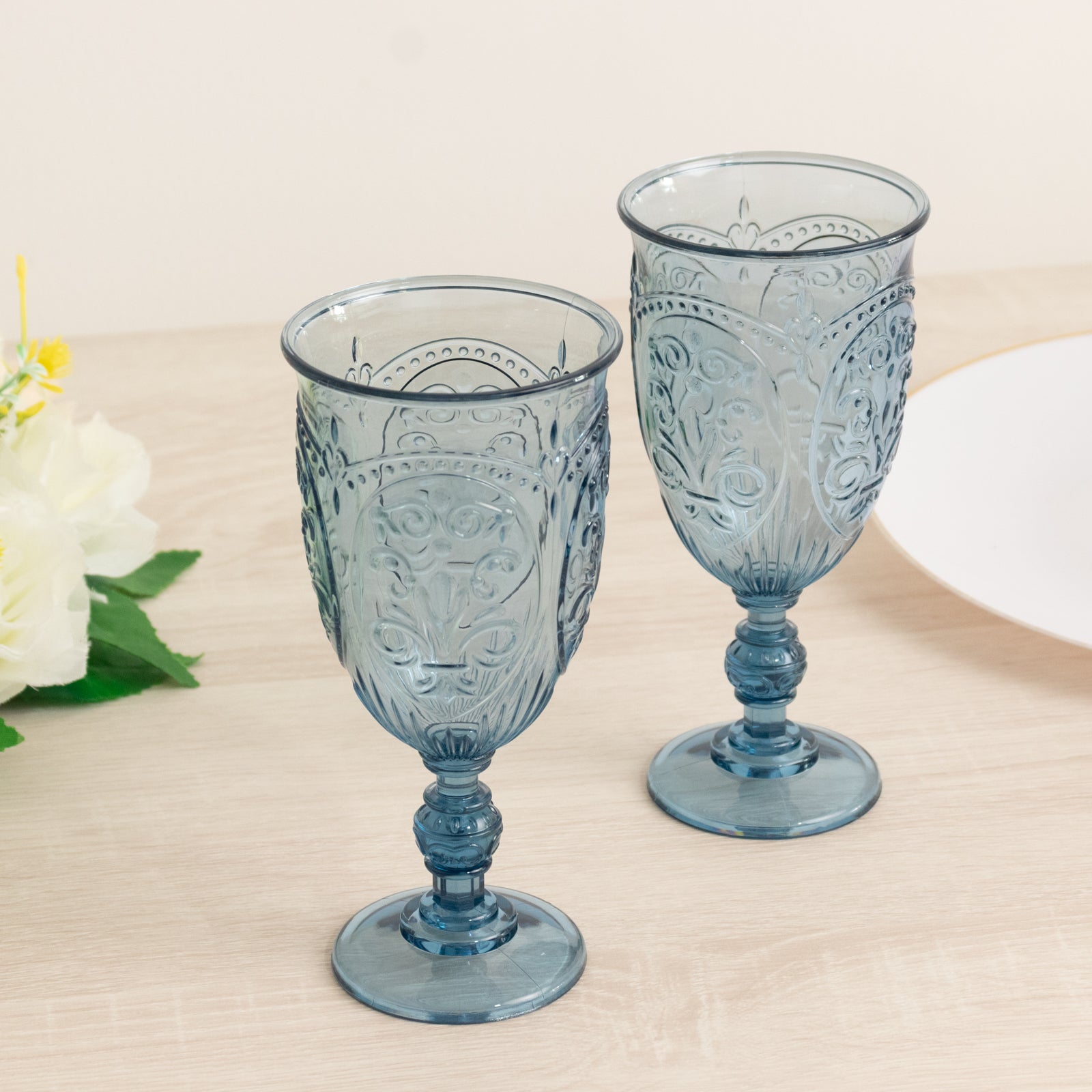 Transparent dusty blue vintage goblets with embossed design.