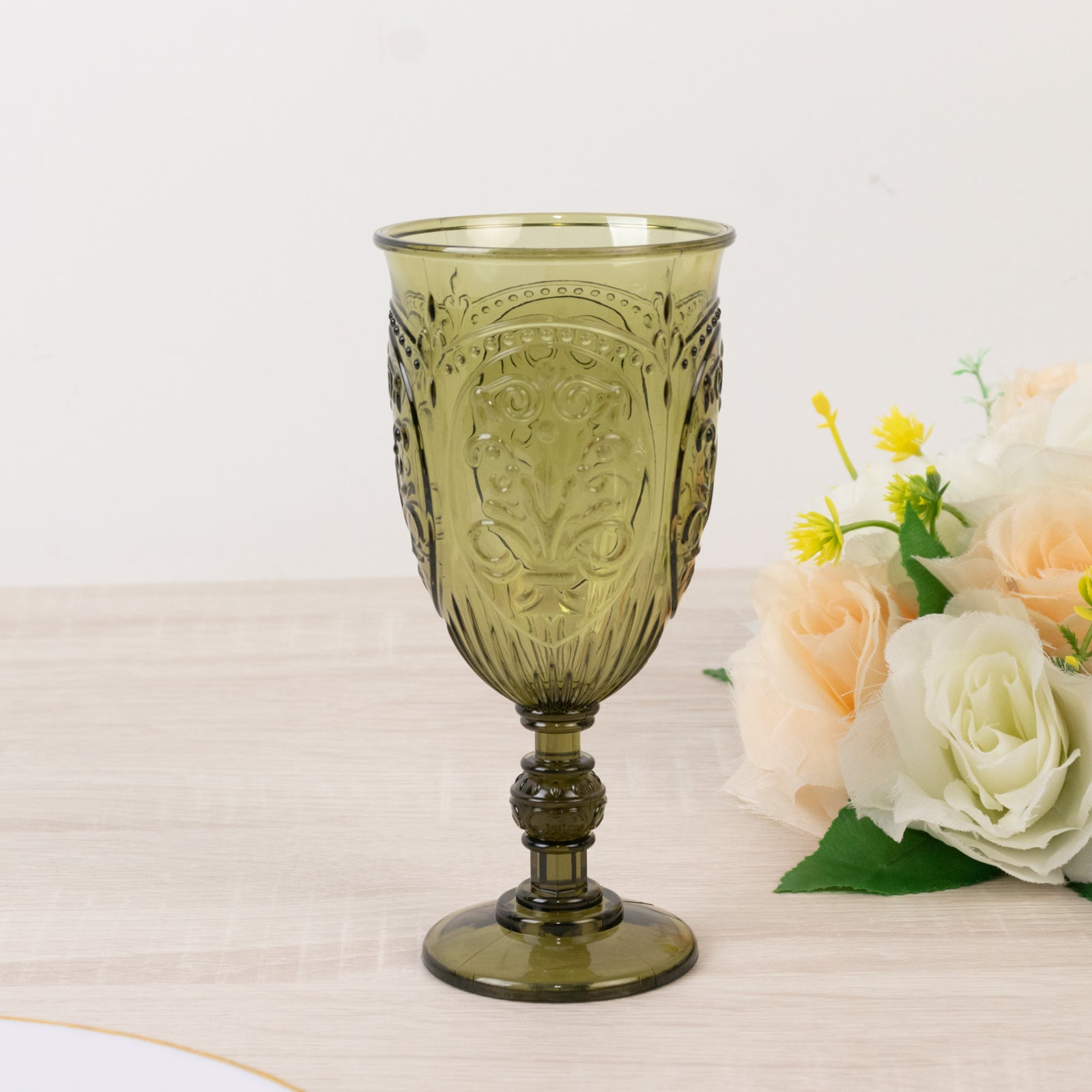 Transparent dusty sage green vintage goblet with embossed design.