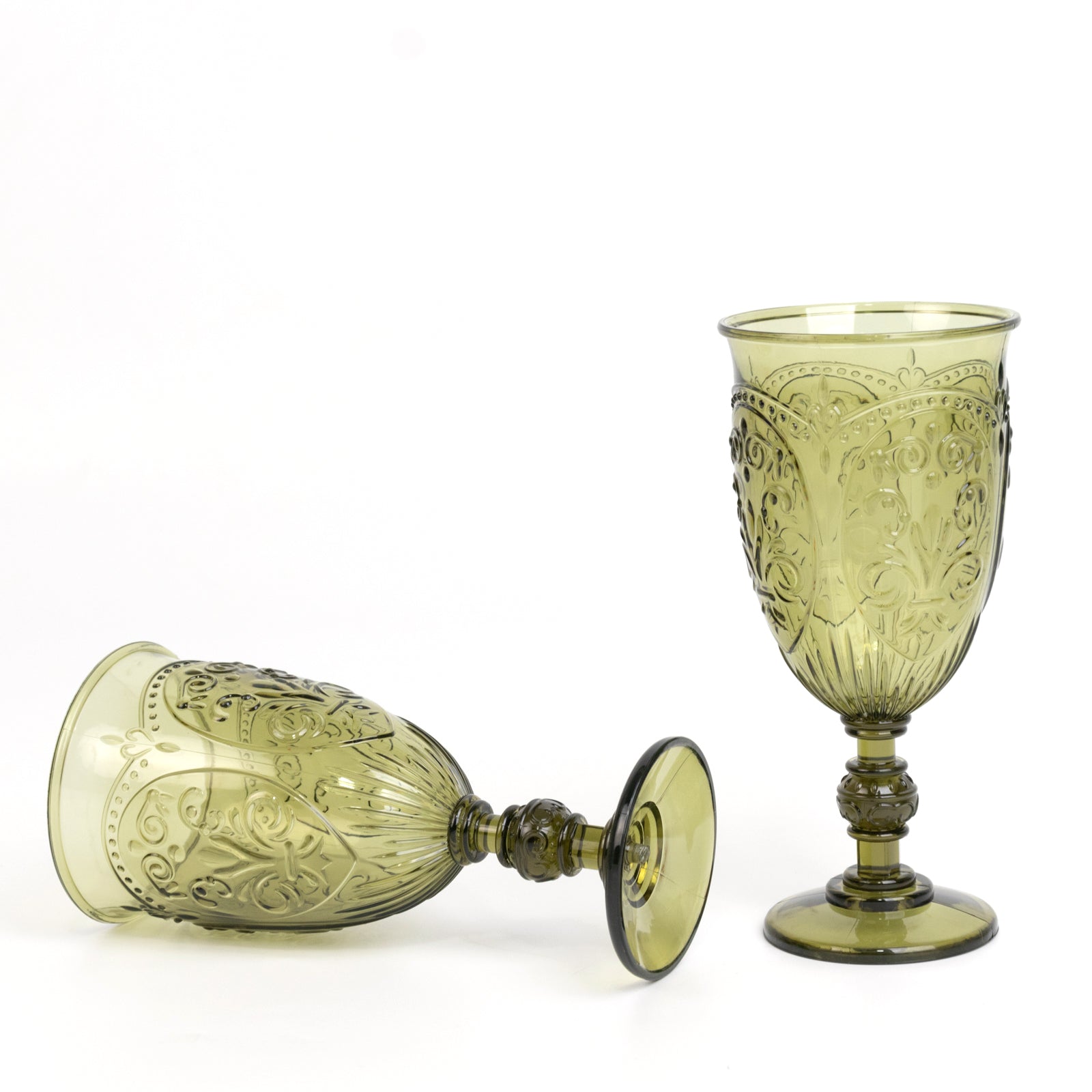 Transparent dusty sage green vintage goblets with retro embossed design.