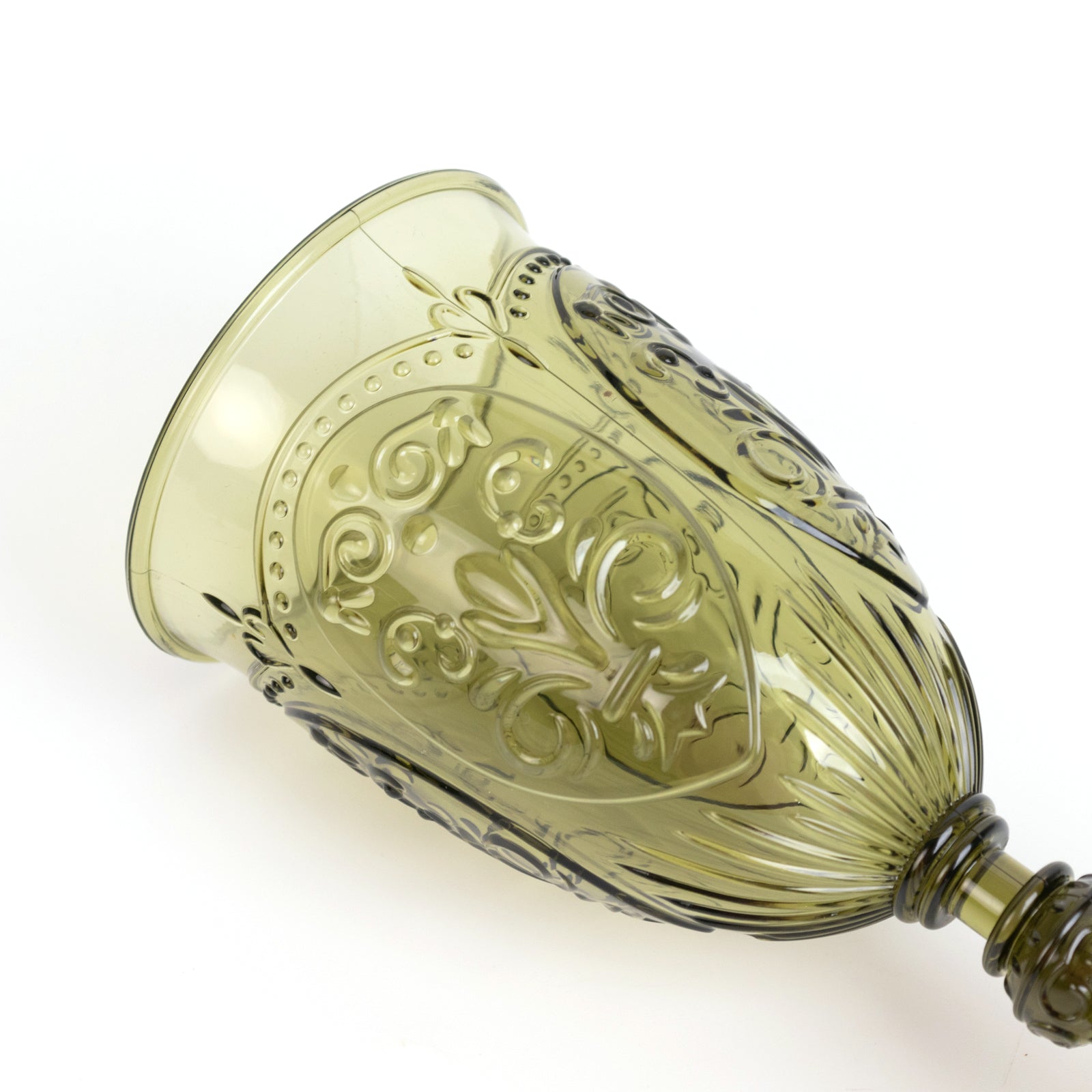 Transparent dusty sage green vintage wine glass with embossed design.