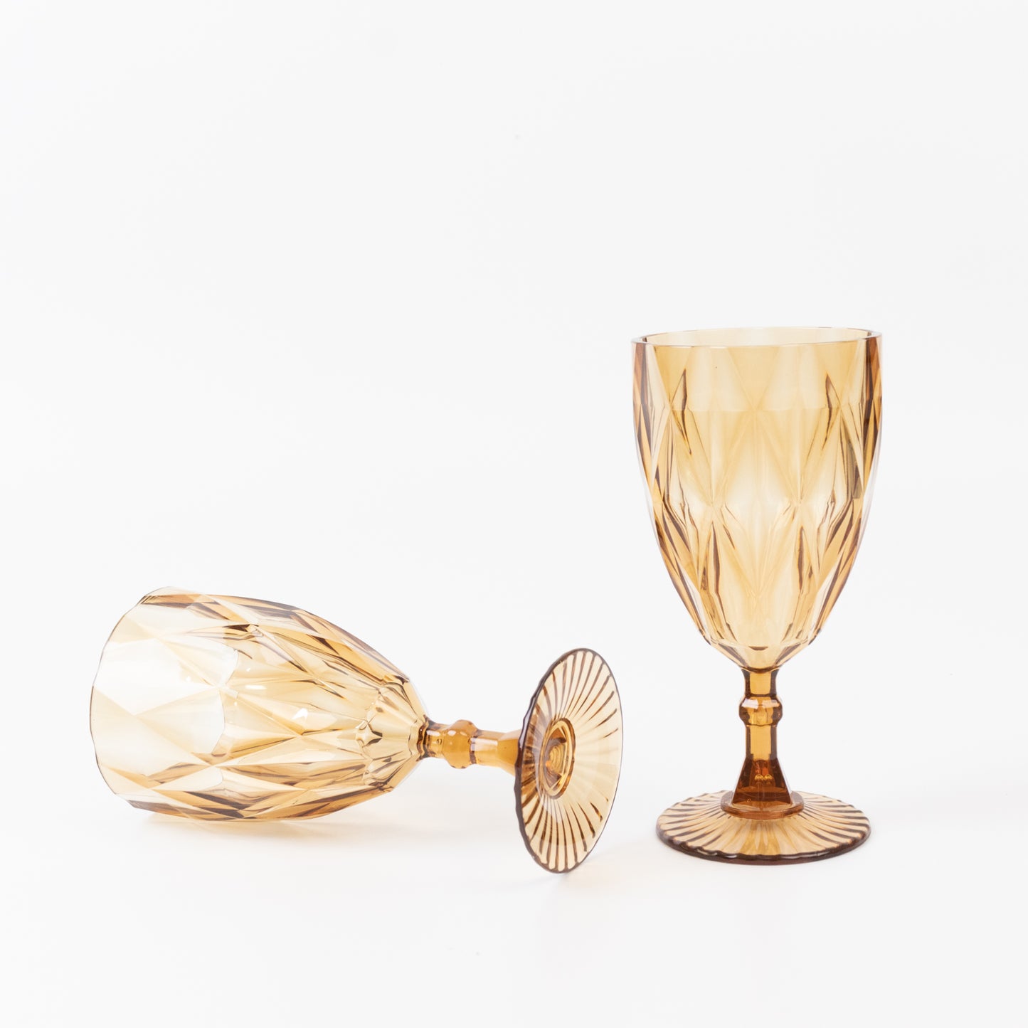 Amber gold vintage diamond cut plastic goblets.