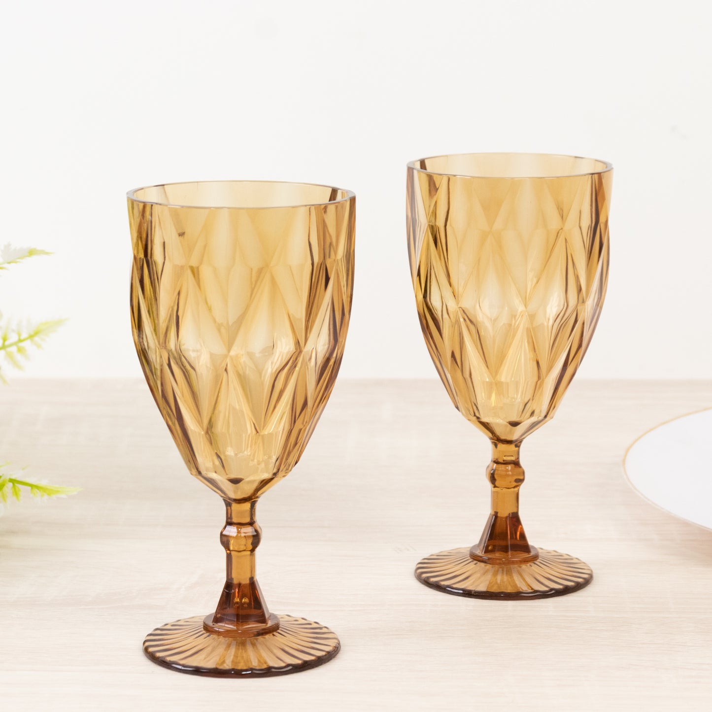 Amber gold vintage diamond cut plastic goblets.