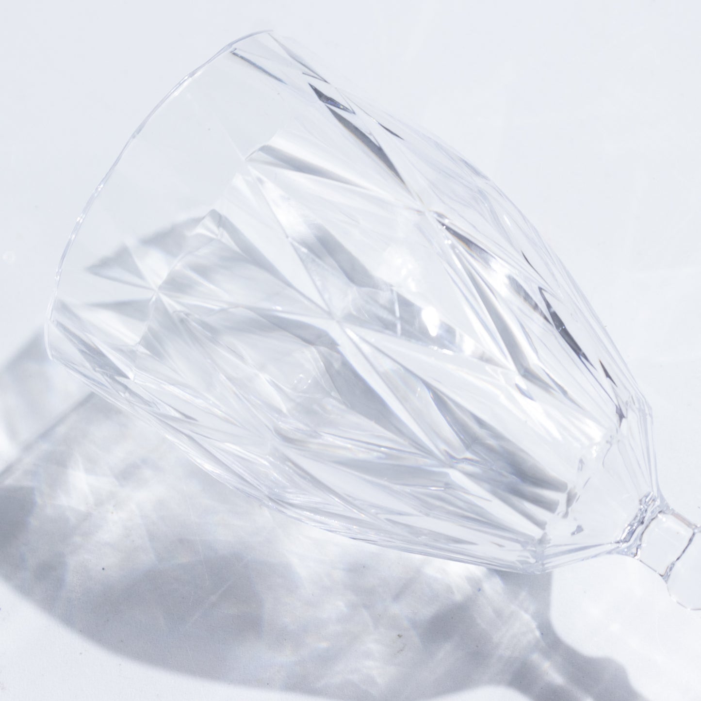 Clear vintage diamond cut plastic goblet for wine and beverages.