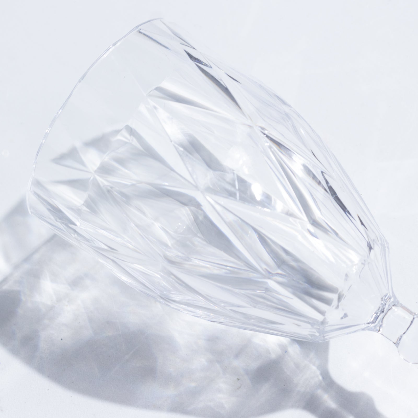 Clear vintage diamond cut plastic goblet for wine and beverages.