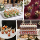 Clear mini disposable teardrop dessert cups with colorful snacks.