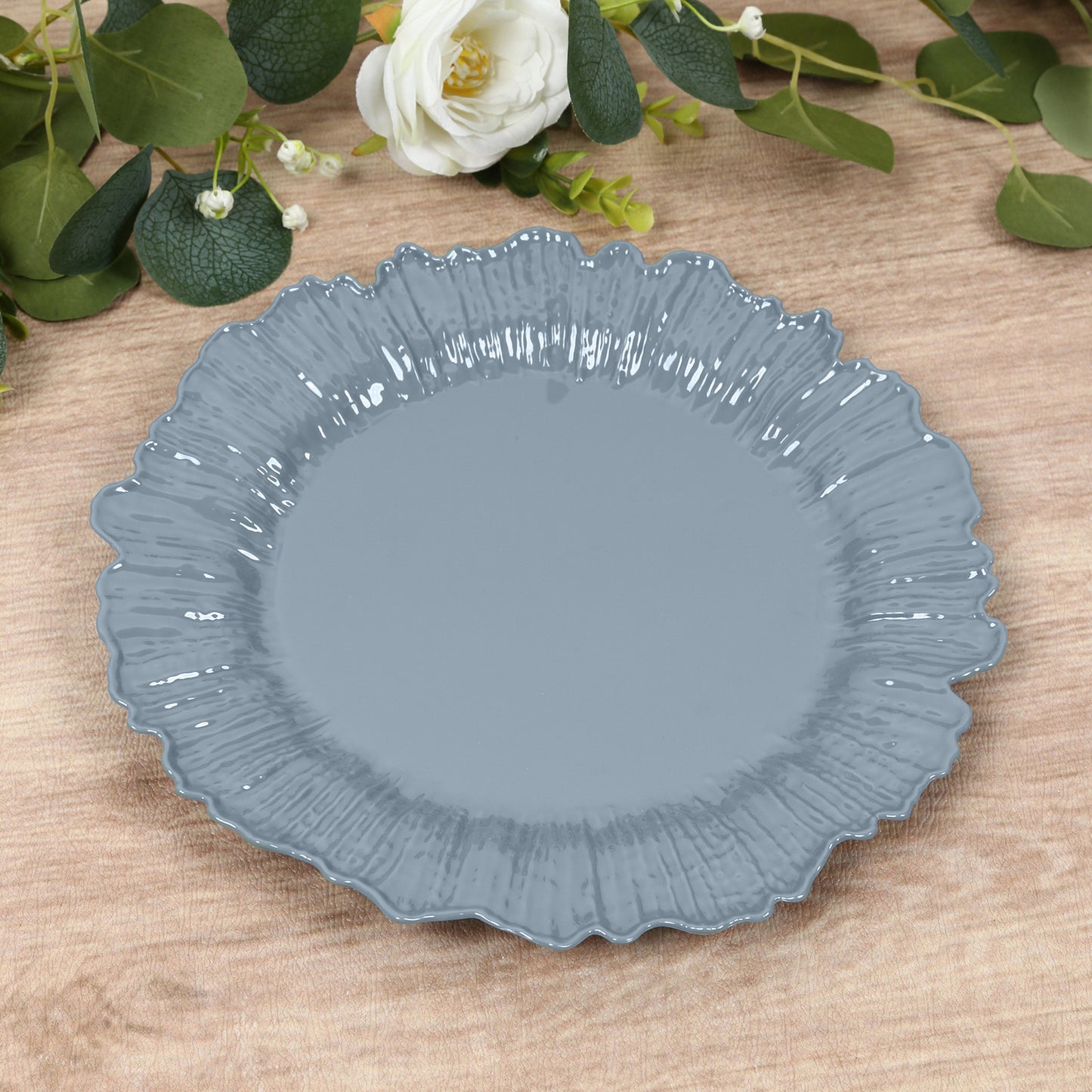 Dusty blue plastic dinner plate with elegant design.