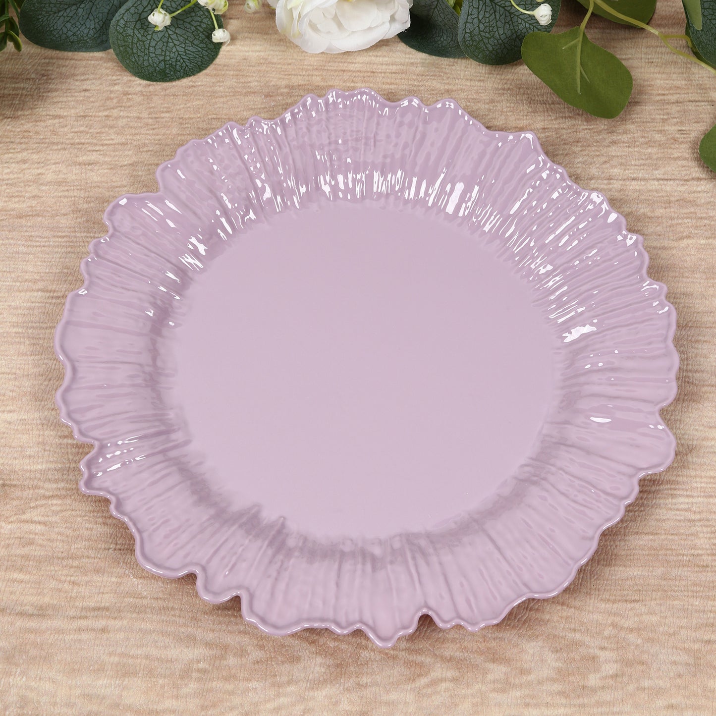 Lavender disposable dinner plate with a decorative reef design.