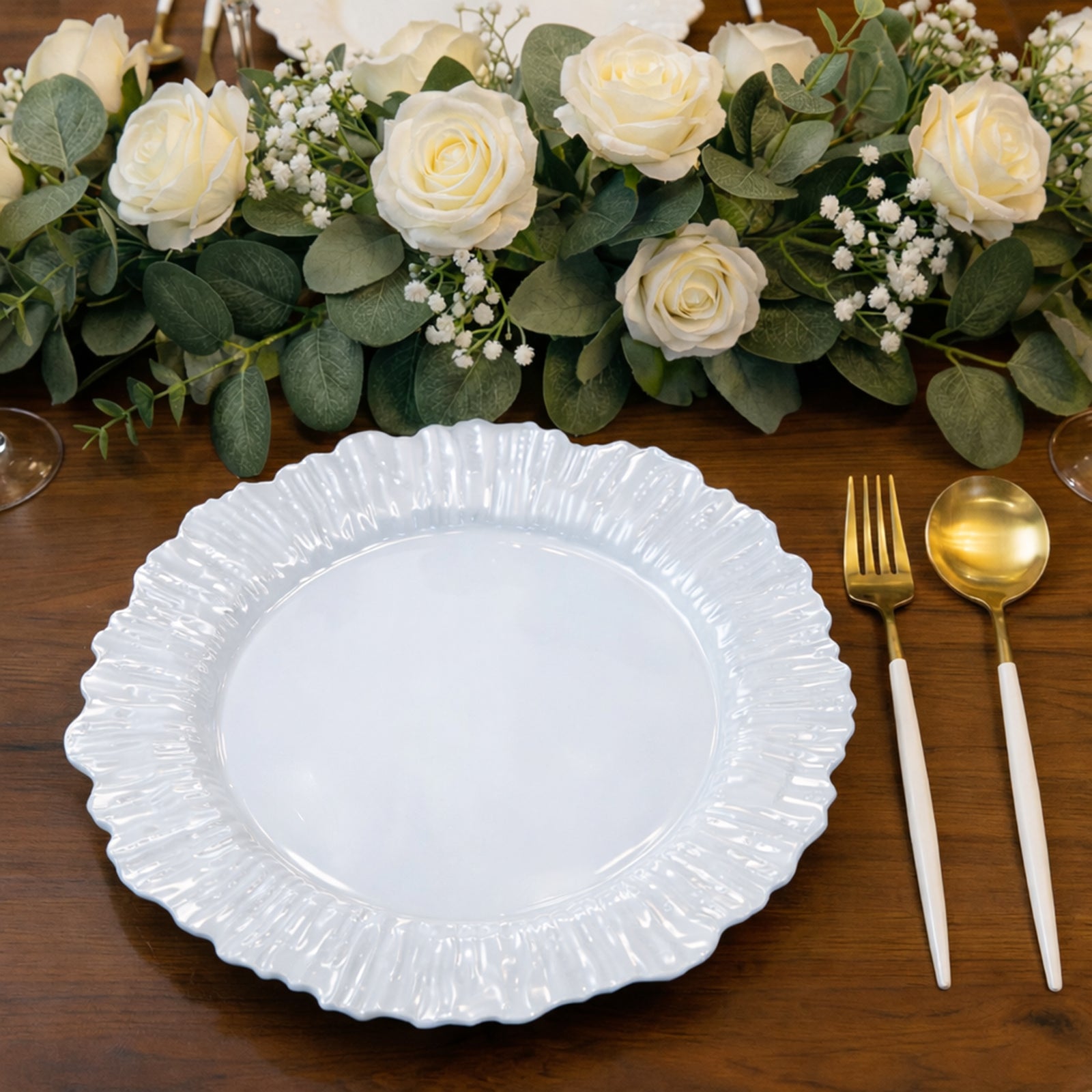 Pearl white disposable dinner plate with elegant reef design.