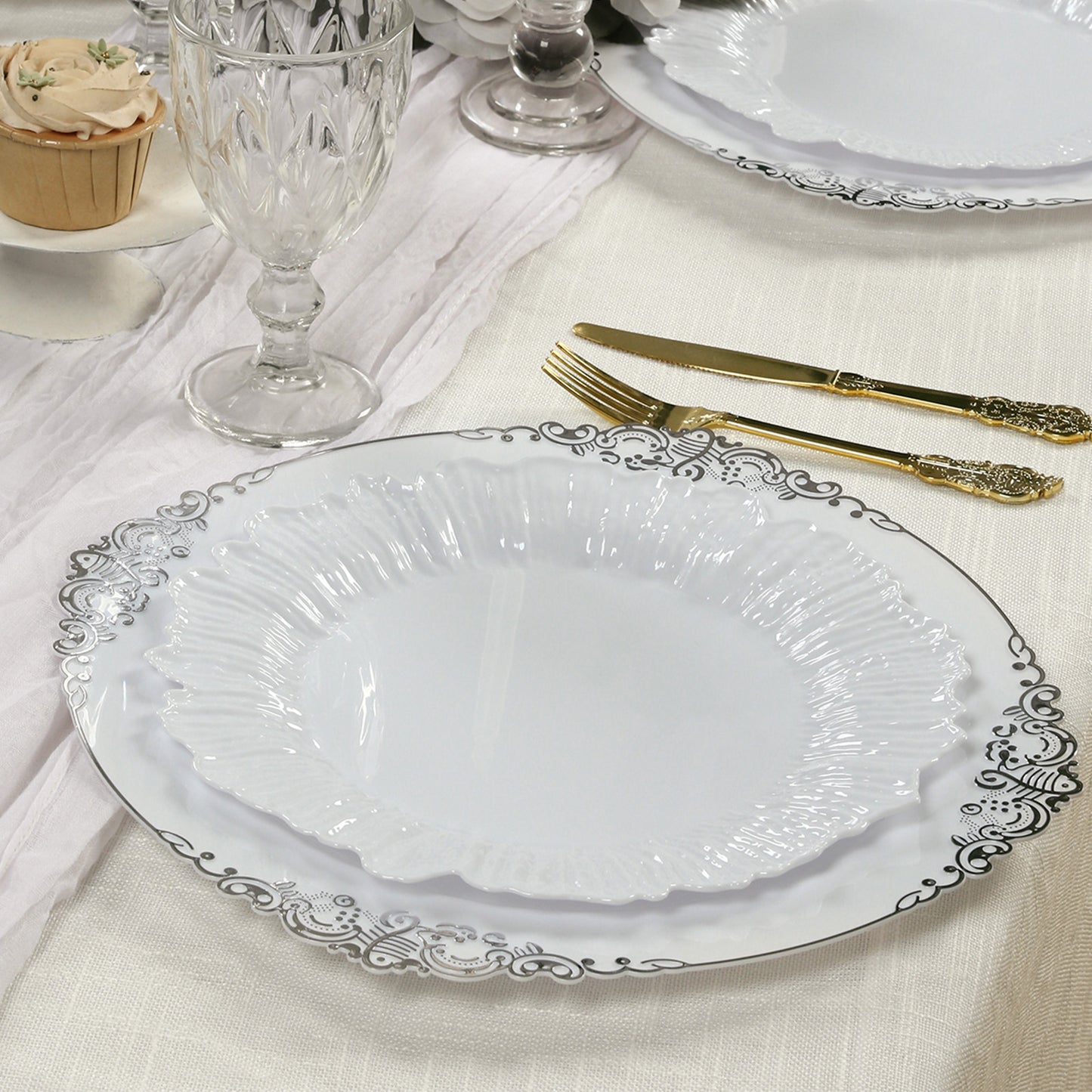 White plastic dinner plates with elegant reef design.