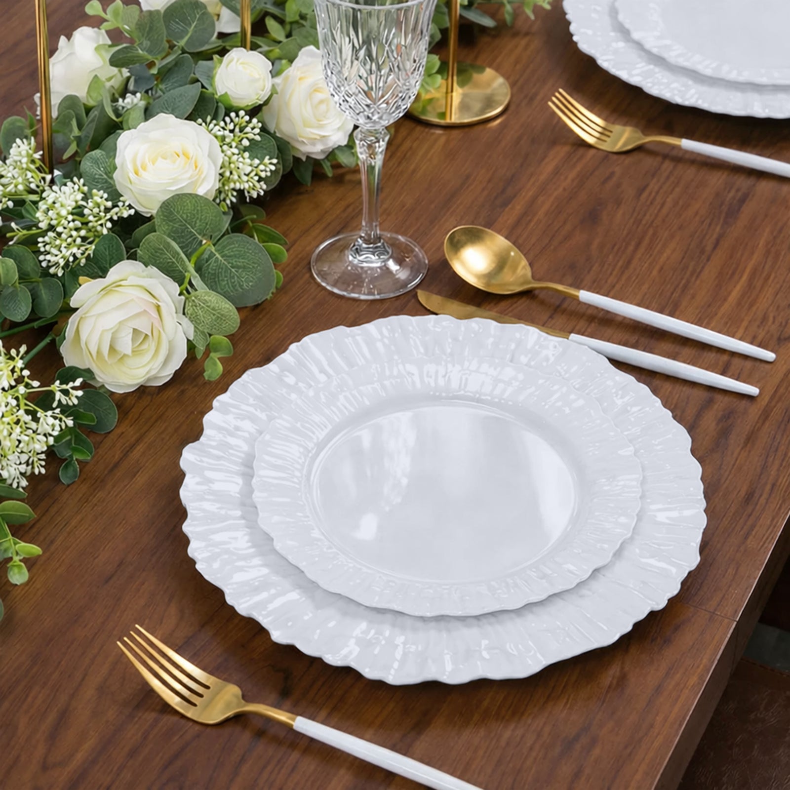 Pearl white reef design disposable dessert plates on a wooden table setting.