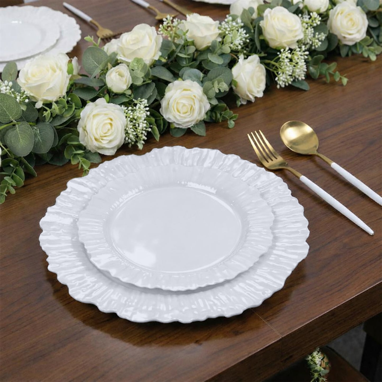 Pearl white dessert plates with elegant reef design on a wooden table setting.